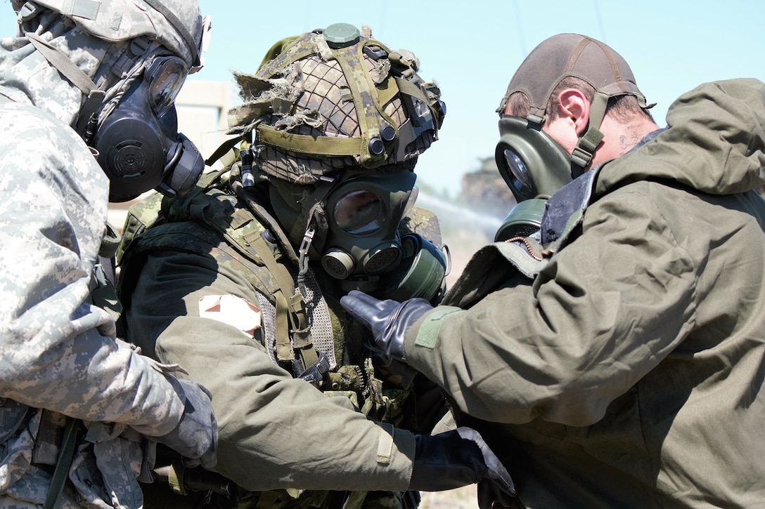 U.S. and Canadian soldiers conduct decontamination operations during Exercise Maple Resolve.