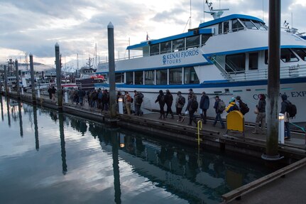 Participants of the 2018 Armed Services YMCA of Alaska Combat Fishing Tournament walk to their assigned charter boats in Seward, Alaska, May 24, 2018. Founded in 2006, the tournament was established as a way of showing thanks and honor to service members through an opportunity to go deep-sea fishing. Because of community support and the volunteerism of the more than 660 crew members and 275 professional fishing charters supplying their time and services, more than 2,400 currently serving military personnel have been able to participate since its inception.