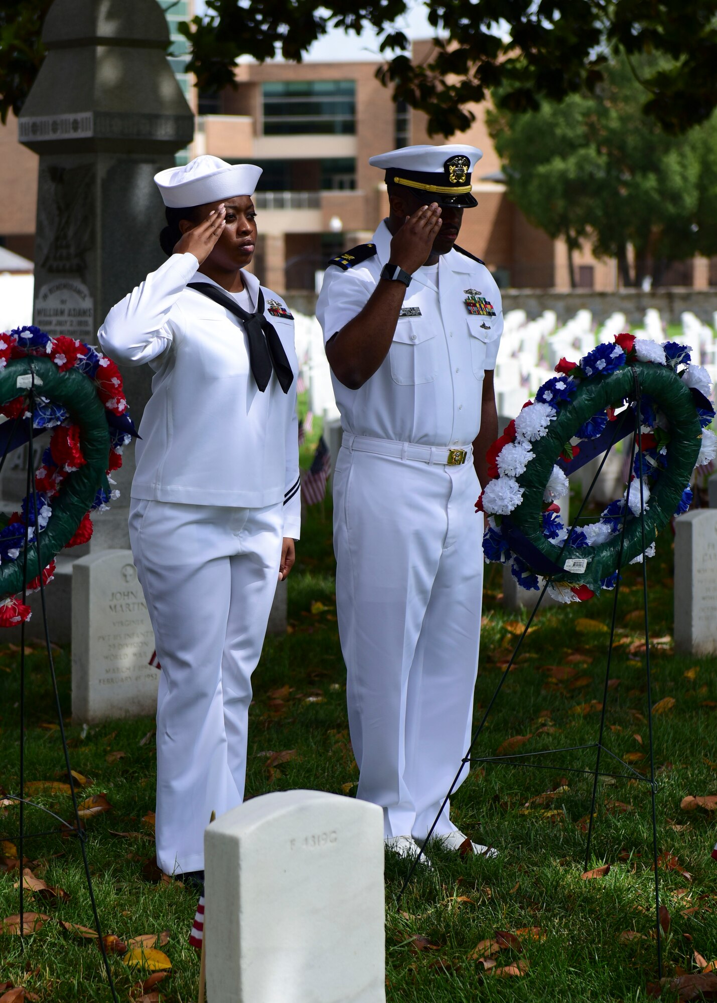 U.S. Navy Sailors render a salute after placing a ceremonial wreath during a Memorial Day wreath-laying ceremony at Hampton National Cemetery in Hampton, Virginia, May 28, 2018. Ceremonial wreaths representing each branch of service were laid to commemorate the fallen service members’ sacrifice. (U.S. Air Force photo by Airman 1st Class Monica Roybal)