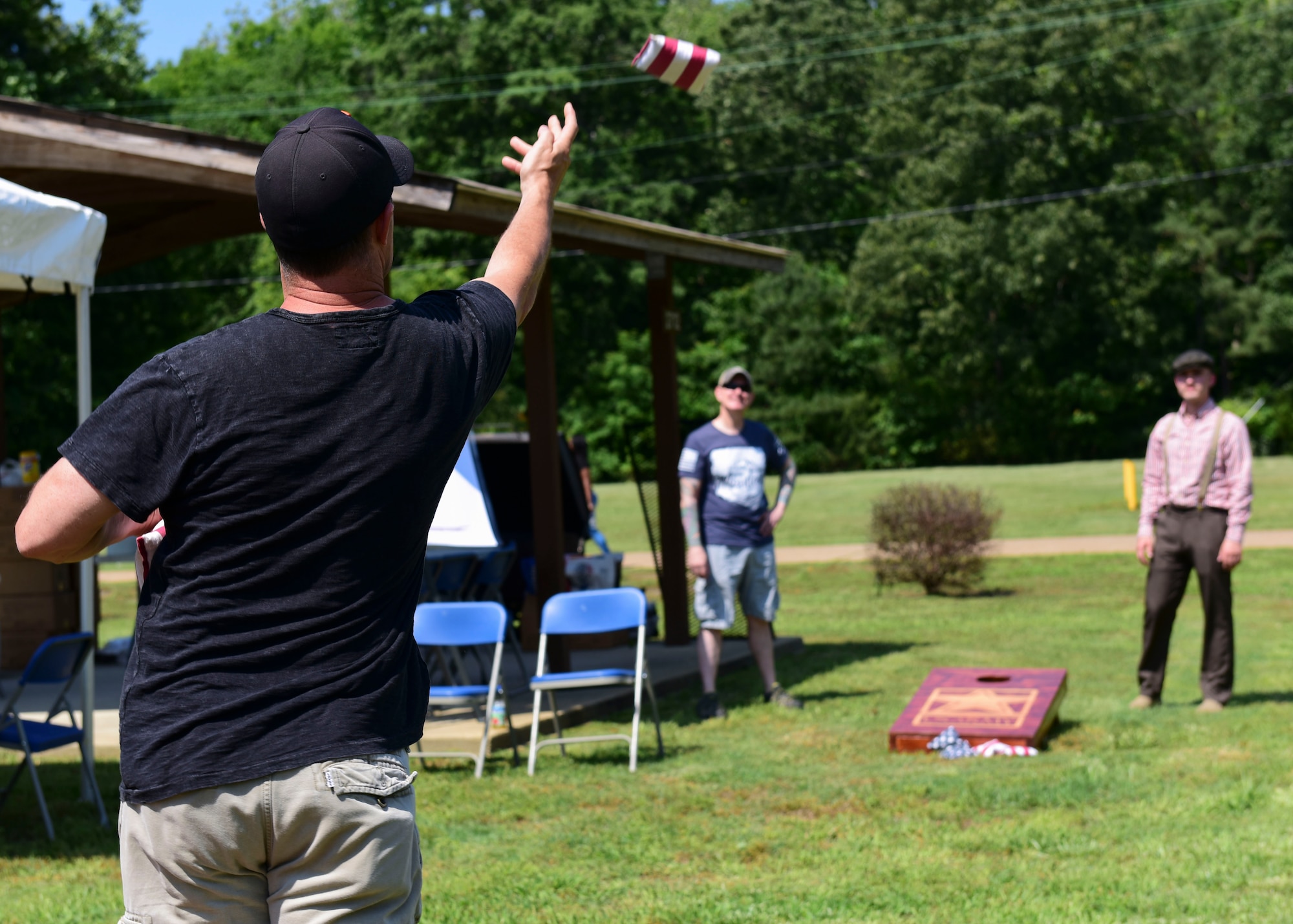 U.S. Army Soldiers play cornhole during the 128th Aviation Brigade Safety Day event at Joint Base Langley-Eustis, Virginia, May 24, 2018. The event also focused on educating Soldier’s families and provided morale activities. (U.S. Air Force photo by Airman 1st Class Monica Roybal)