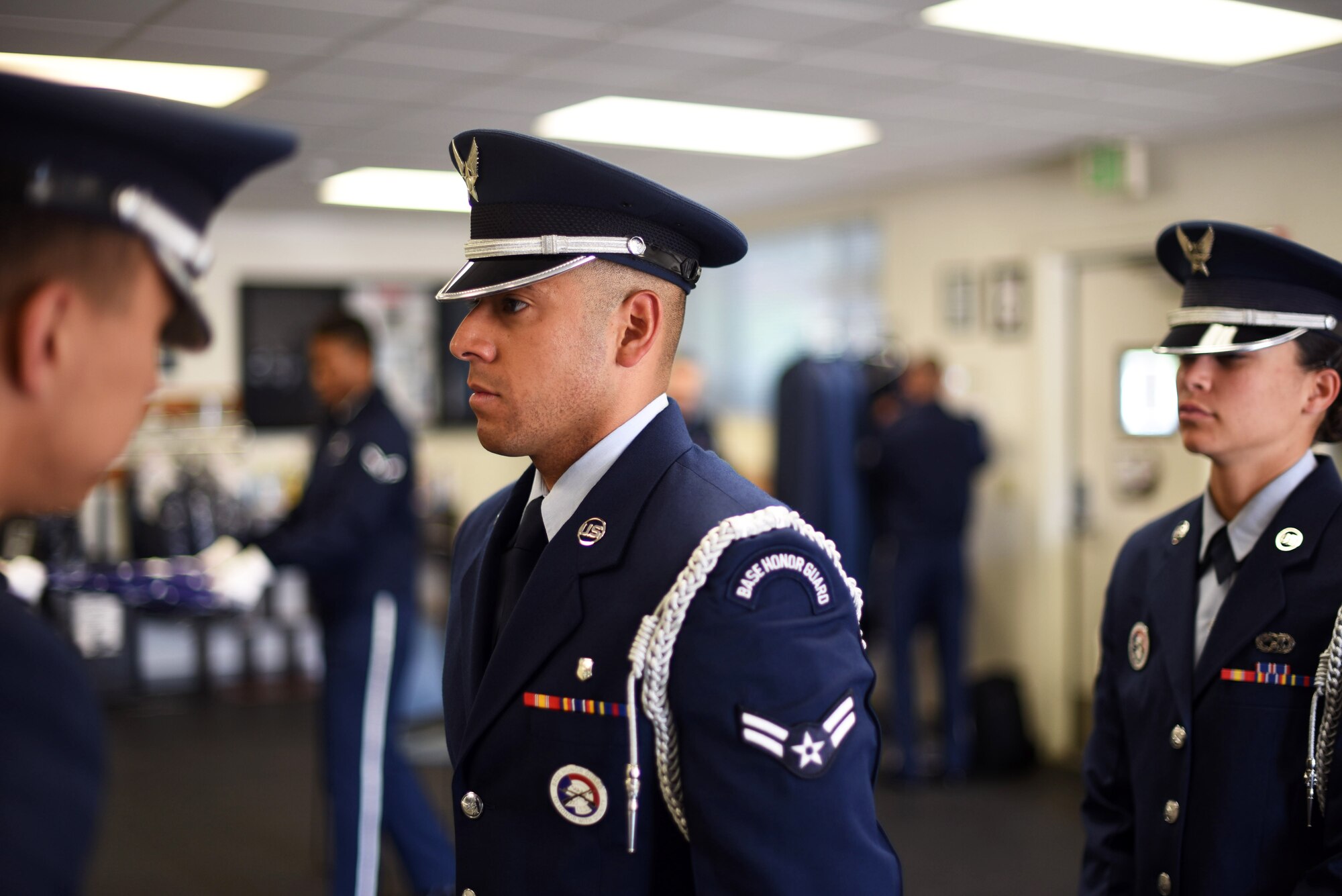 U.S. Air Force Staff Sgt. Steven C. Flynn, Travis Air Force Base Honor Guard lead instructor, inspects the ceremonial uniform of Airman First Class Mario Hernandez, 60th Medical Operations Squadron aerospace medical technician, May 22, 2018, at the Honor Guard building at Travis AFB, Calif. The Travis Honor Guard's area of responsibility spans 45,000 square miles serving 28 counties with 1 million veteran residents.  (U.S. Air Force photo by Airman 1st Class Jonathon D. A. Carnell)