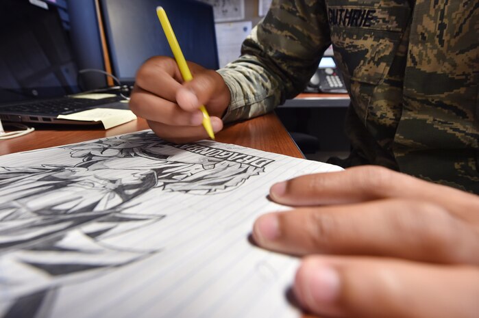 Senior Airman Jordan Guthrie, 437th Aerial Port Squadron passenger travel technician, sketches and traces over a drawing here May 30, 2018. Guthrie was selected by his leadership to design art for a squadron mural. The mural highlights the “Port Dawgs” heritage, showcasing highlights of the squadron’s culture. Guthrie has been drawing and practicing art since he was 10 years old.