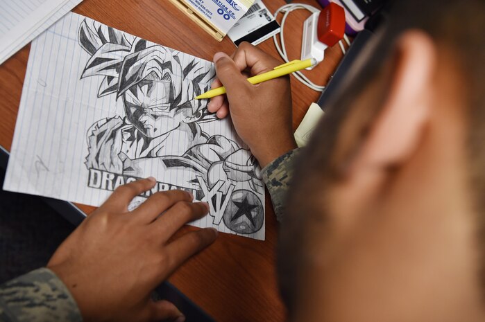 Senior Airman Jordan Guthrie, 437th Aerial Port Squadron passenger travel technician, sketches and traces over a drawing here May 30, 2018. Guthrie was selected by his leadership to design art for a squadron mural. The mural highlights the “Port Dawgs” heritage, showcasing highlights of the squadron’s culture. Guthrie has been drawing and practicing art since he was 10 years old.