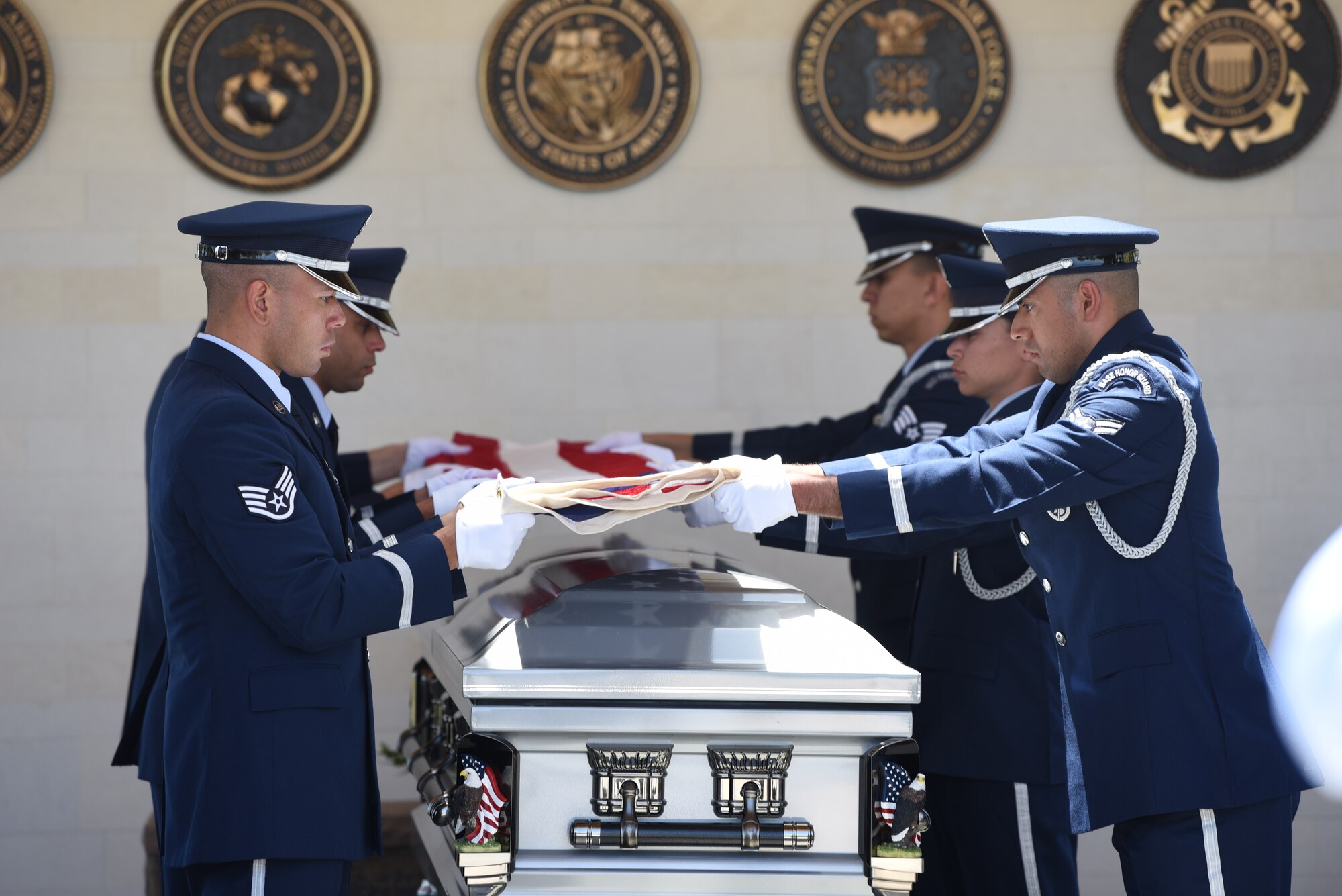 Travis Air Force Base Honor Guard member’s perform a six person flag fold May 22, 2018, at Sacramento Valley National Cemetery, Calif. Travis’ Honor Guard covers 45,000 sq. miles to include four National Commentaries, two VA’s and every private resting area between. (U.S. Air Force photo by Airman 1st Class Jonathon D. A. Carnell)