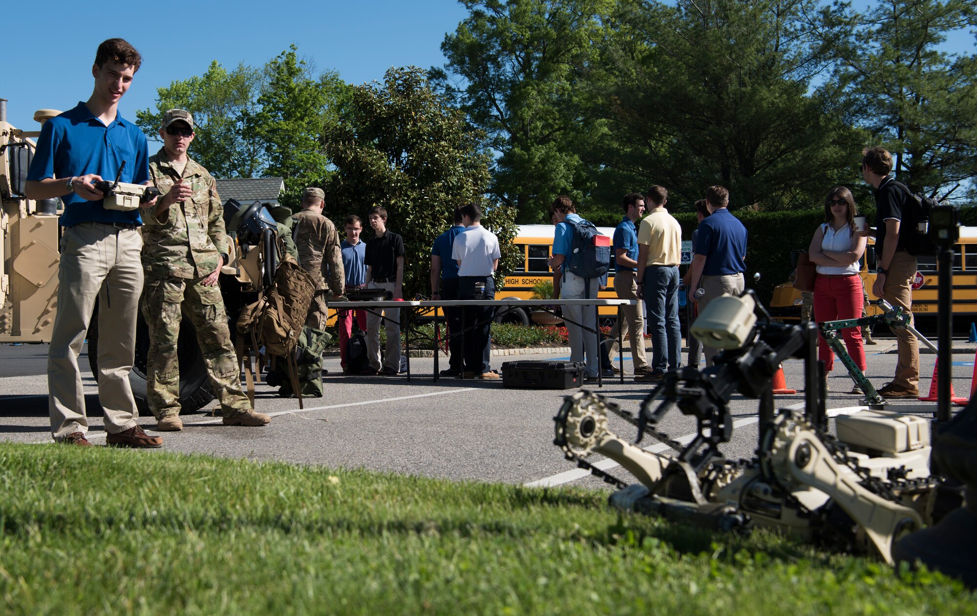 Chris Bonin, 17, a Christian Brothers Academy student, remotely controls a robot during Honor Day at the Eagle Oaks Golf and Country Club in Farmingdale, N.J., May 24, 2018. Honor Day is an annual science, technology, engineering and math exposition held during the week of Memorial Day to honor and remember fallen service members and recruit new ones. The robot is a tool used in career fields such as explosive ordnance disposal to relocate explosives without endangering others. (U.S. Air Force photo by Airman Ariel Owings)