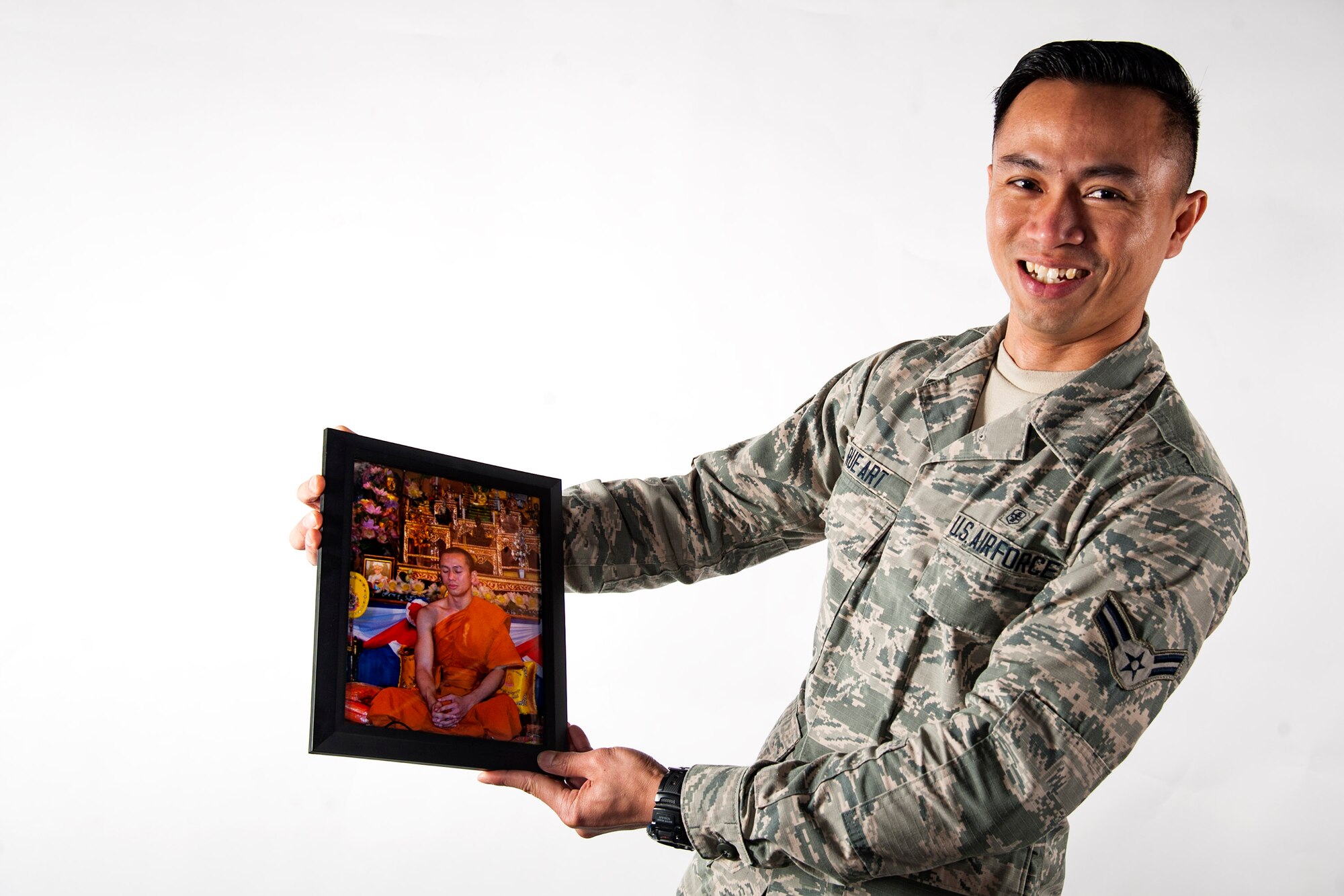 Airman 1st Class Kornkawee Rue Art, 23d Medical Support Squadron pharmacy technician, poses for a photo, March 21, 2018, at Moody Air Force Base, Ga. After spending 18 years as a monk, Rue Art traded his robes for a uniform, in his continual pursuit of a life bigger than himself; one of meaning and purpose. (U.S. Air Force photo by Airman 1st Class Erick Requadt)