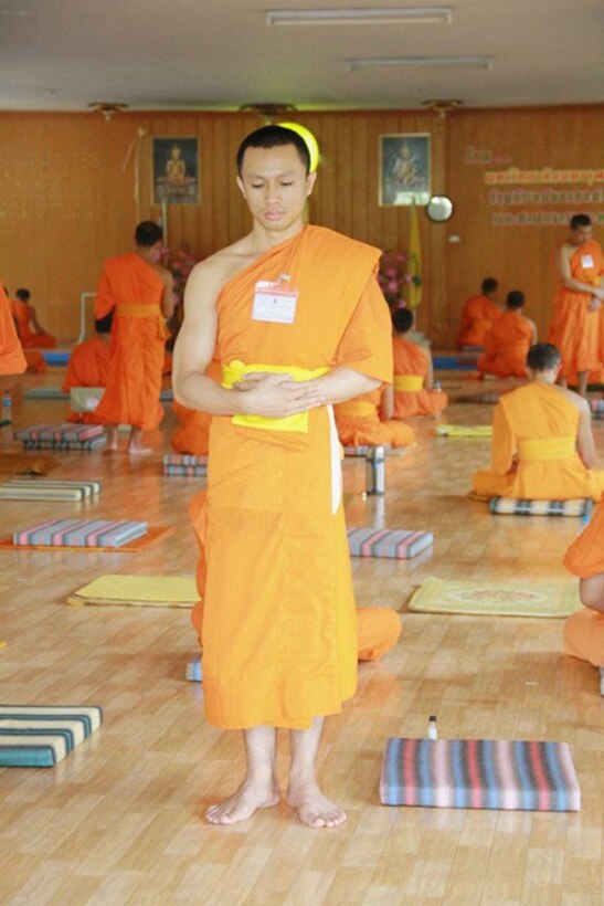 Airman 1st Class Kornkawee Rue Art, 23d Medical Support Squadron pharmacy technician, formally a Thailand Buddhist monk, practices meditation techniques while at a temple. After spending 18 years as a monk, Rue Art traded his robes for a uniform, in his continual pursuit of a life bigger than himself; one of meaning and purpose. (Courtesy Photo)
