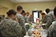 Base members get food from a buffet line during the Asian American and Pacific Islander Heritage Month Luncheon May 30, 2018, at the Air Base Chapel Annex. Asian American and Pacific Islander Heritage Month, celebrated throughout the month of May, honors Asians and Pacific Islanders in the United States.