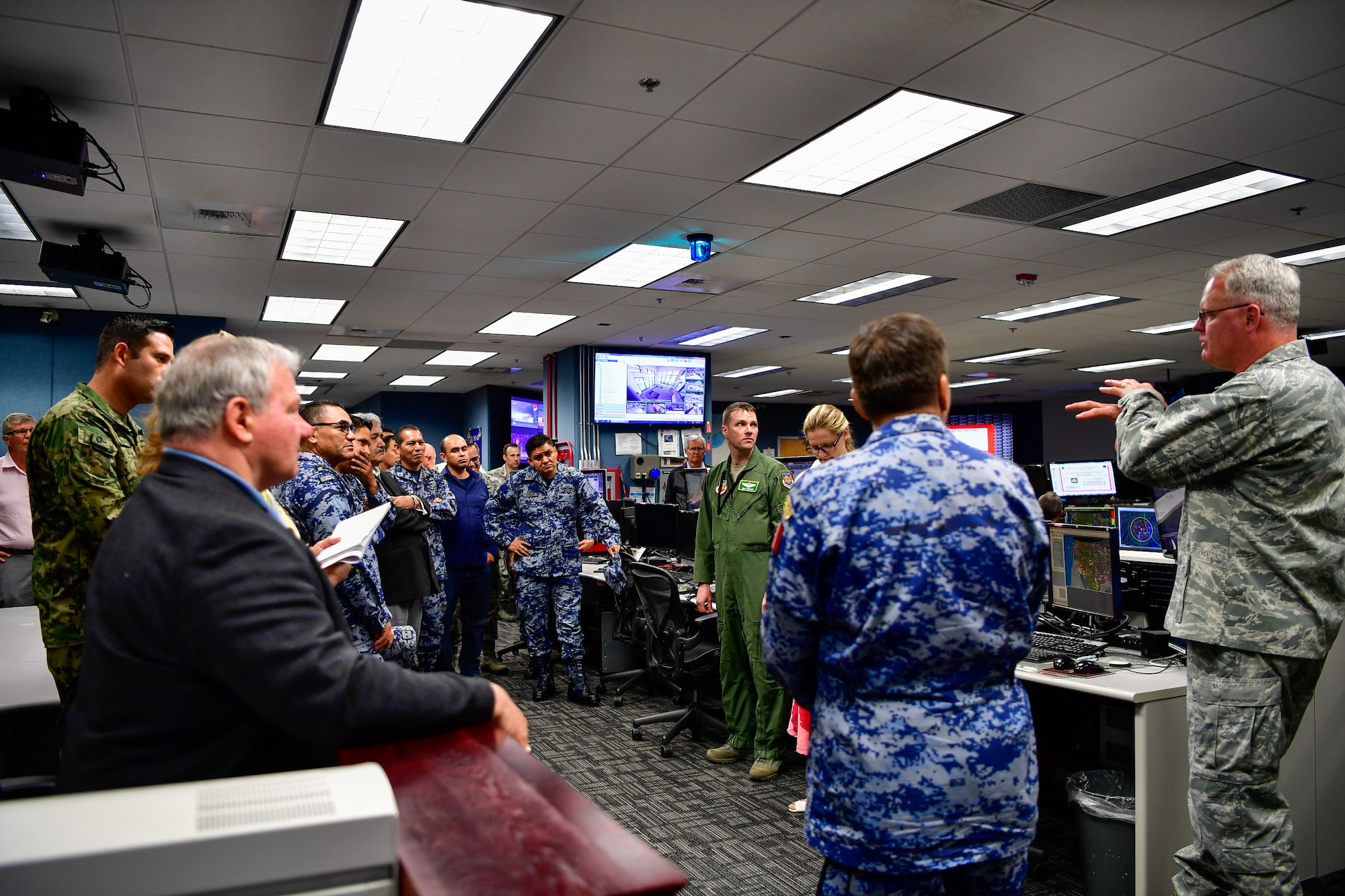AMALGAM EAGLE 18 exercise planners tour the Western Air Defense Sector operations floor May 22, 2018. Col. William Krueger (far right), 225th Air Defense Group commander, answers questions from the group.  AMALGAM EAGLE 18 is a tactical exercise which is designed to enhance mutual warning and information sharing procedures in support of a cooperative response to illicit flights that cross the U.S.-Mexico border.
