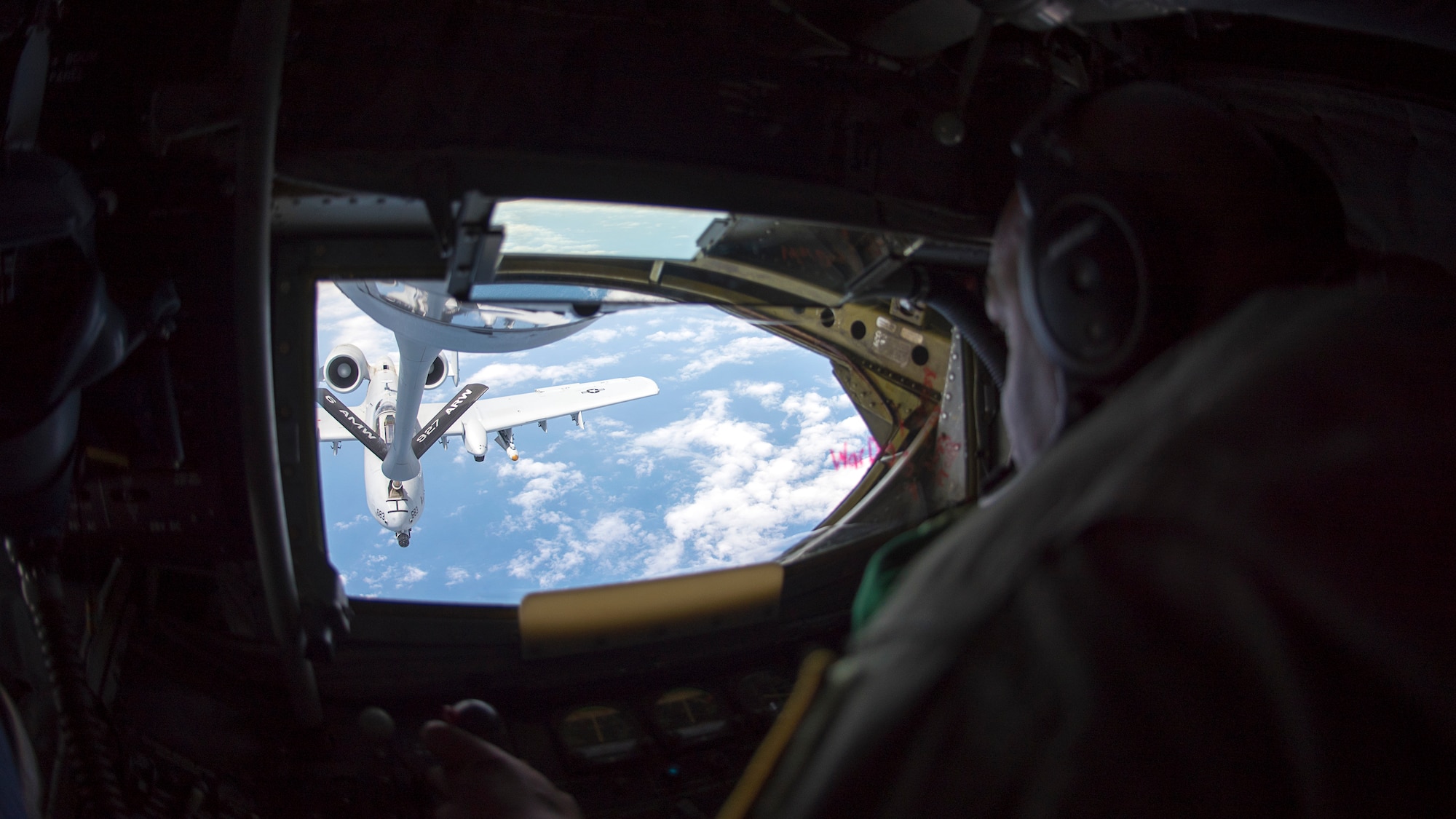 U.S. Air Force Master Sgt. Bob Jenkins, a boom operator assigned to the 91st Air Refueling Squadron at MacDill Air Force Base, Fla., refuels an A-10 Thunderbolt II aircraft from the 175th Wing, Maryland Air National Guard, May 24, 2018. During air refueling, the boom operator is in charge of safely offloading the necessary fuel to the incoming aircraft.
