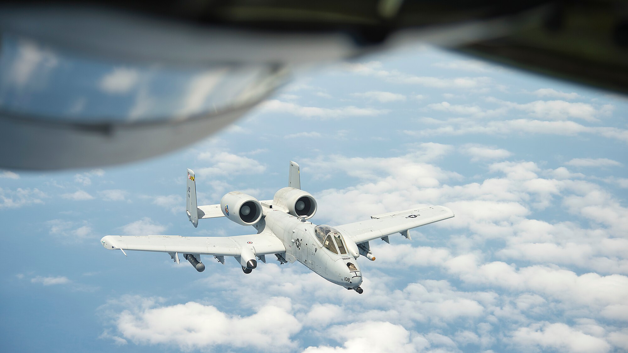 An A-10 Thunderbolt II aircraft from the 175th Wing, Maryland Air National Guard, prepares to bank left after receiving fuel from a KC-135 Stratotanker aircraft from MacDill Air Force Base, Fla., May 24, 2018. MacDill’s mission is to provide unmatched air refueling and executive airlift to support joint and coalition forces across the globe.