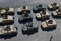 Humvees lined up in rows.