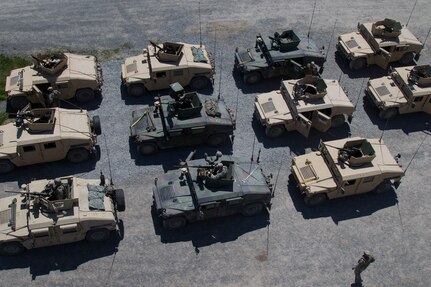 Humvees lined up in rows.