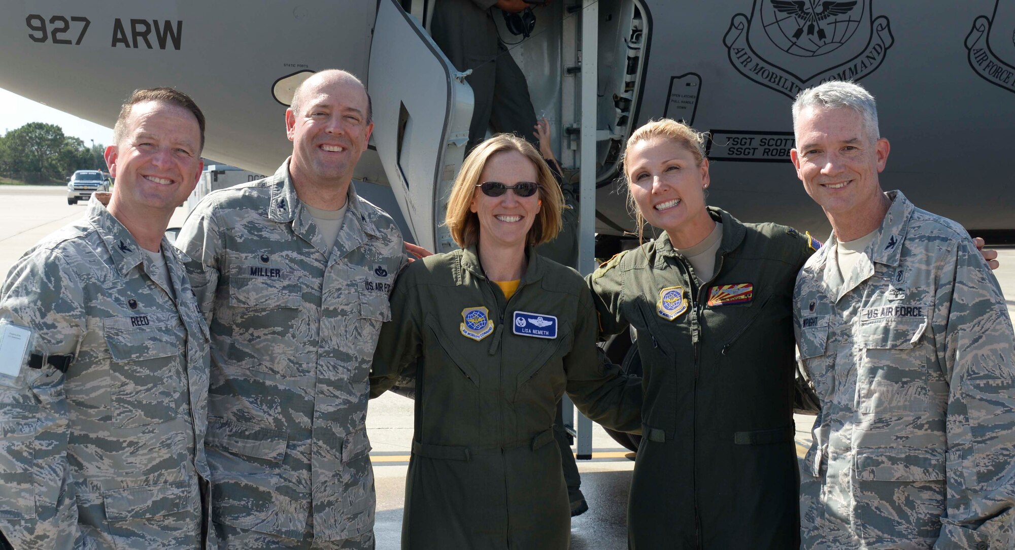 U.S. Air Force Col. April Vogel, (second from right), commander of the 6th Air Mobility Wing (AMW), pauses for a photo with 6th AMW group commanders during her fini-flight at MacDill Air Force Base, Fla., May 24, 2018. Airmen, family members and friends came out to celebrate Vogel’s final flight as the 6th AMW commander.