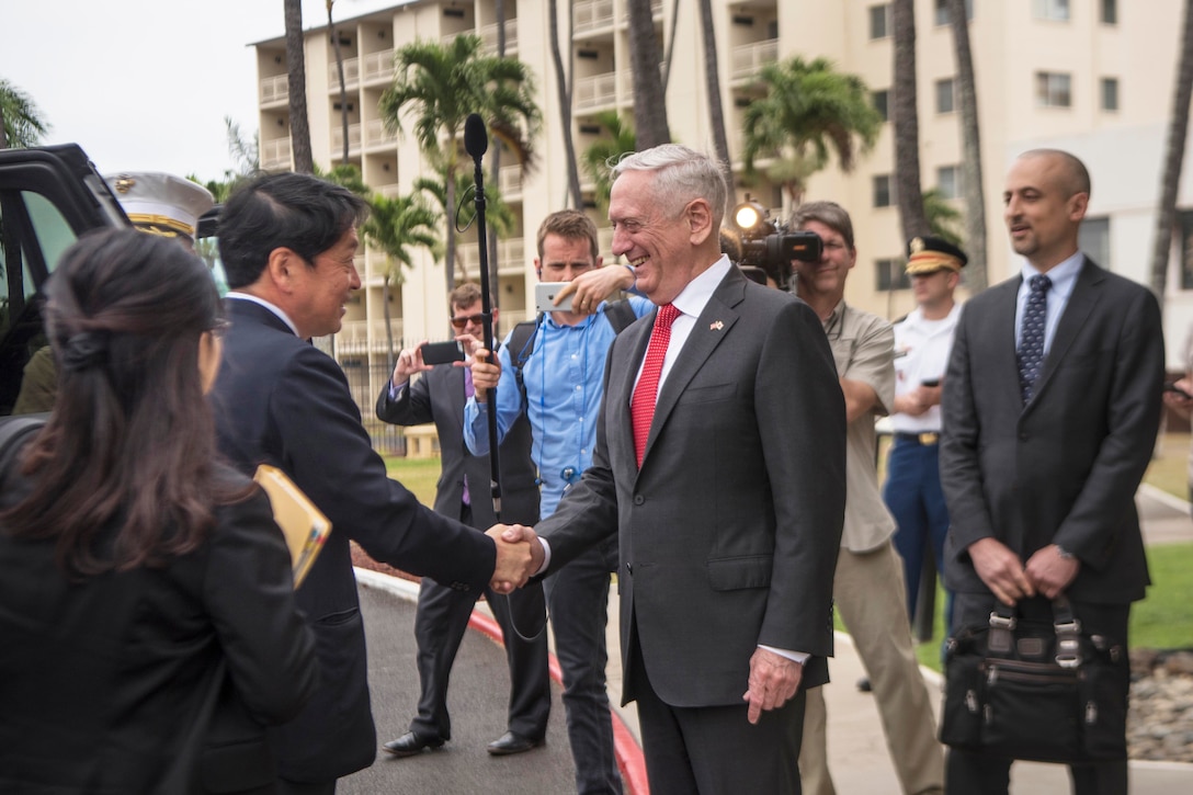 Defense Secretary James N. Mattis shakes hands with the Japanese Defense Minister.