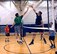 The 932nd Airlift Wing volleyball team practices getting the ball back over the net May 3, 2018, at Scott Air Force Base, Ill. The coach, Master Sgt. Dawn Williams, 932nd Health Professions Recruiter, yells instructions from offscreen. Williams recruits new medical people into the Air Force Reserve by day, and also coaches the 932nd Airlift Wing's volunteer volleyball team at night. (U.S. Air Force photo by Lt. Col. Stan Paregien)