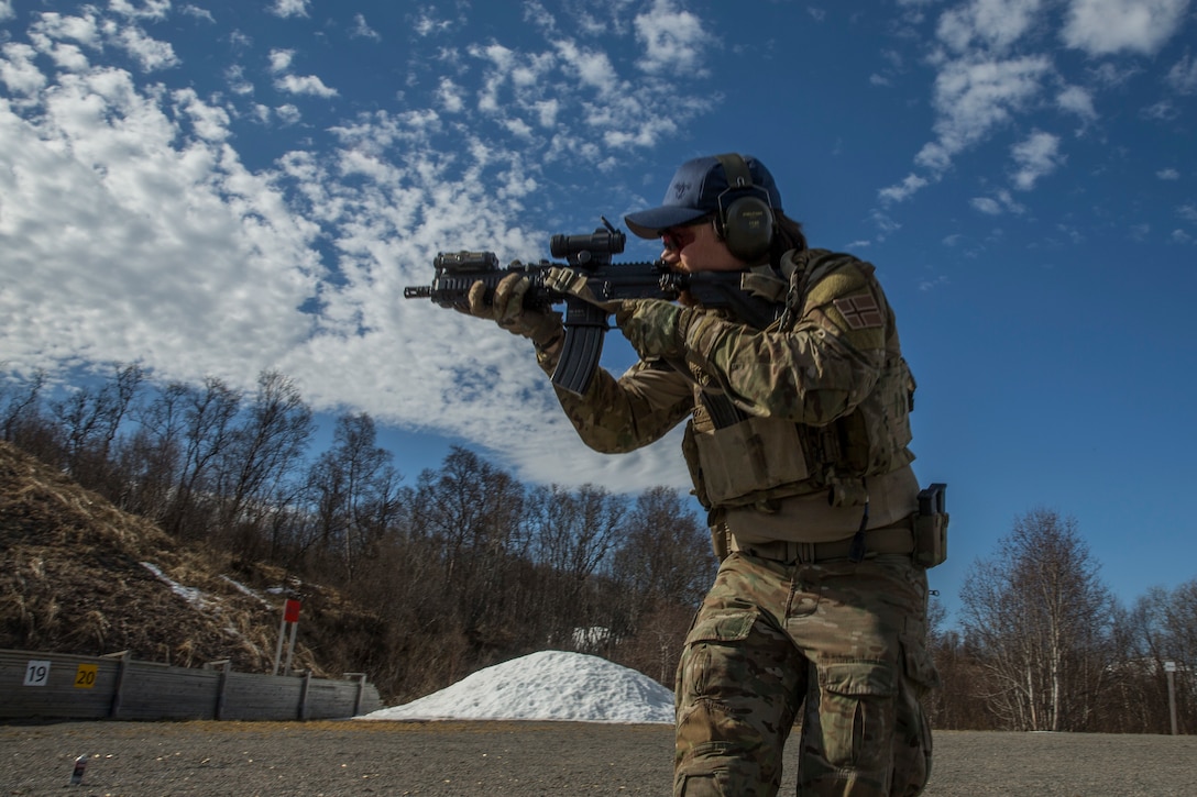 A Norwegian Coastal Ranger Commando (KJK) conducts a shooting drill during Exercise Platinum Ren at Fort Trondennes, Harstad, Norway, May 9, 2018. The exercise is a theater security cooperation training evolution with U.S. Marines of 1st Reconnaissance Battalion and KJKs held to sustain mission essential tasks in a harsh operating environment and strengthen coalition partnerships. (U.S. Marine Corps photo by Cpl. Miguel A. Rosales)