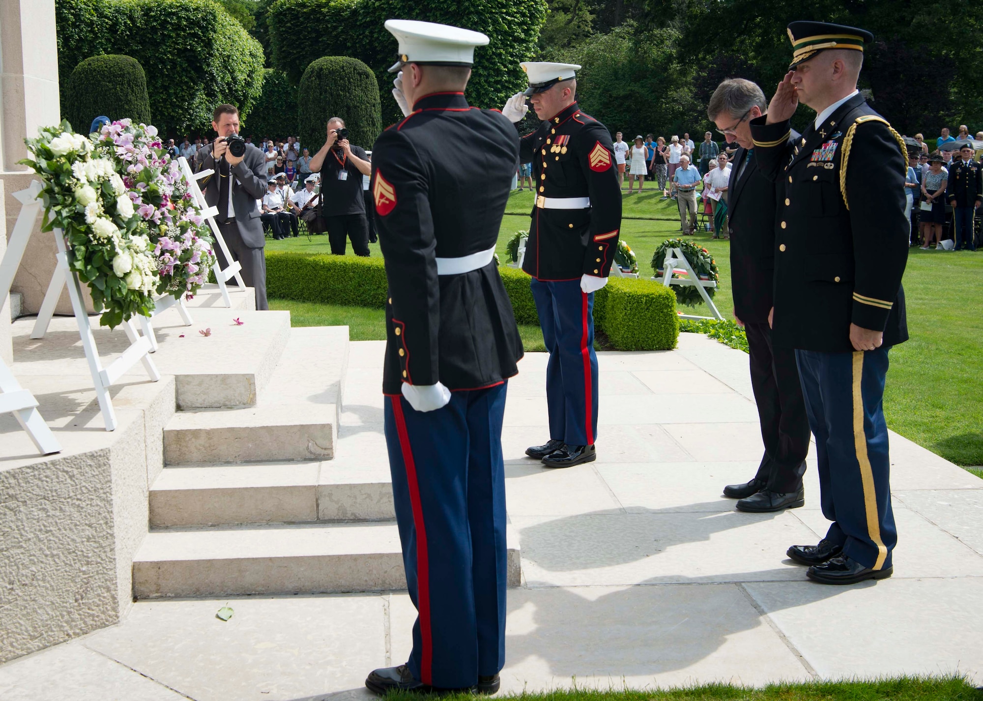 U.S. military and Matthew Lessenhop, center right, Embassy of the United States to the Kingdom of Belgium deputy chief of mission, pay respects after laying a wreath in honor of the fallen during a Memorial Day ceremony at Flanders Field American Cemetery, Belgium, May 27, 2018. Military and civilian representatives attended the ceremony, including Brig. Gen. Dieter E. Bareihs, Headquarters U.S. Air Forces in Europe and Africa director of plans, programs and analyses, and a representative of the King of Belgium. (U.S. Air Force photo by Senior Airman Elizabeth Baker)