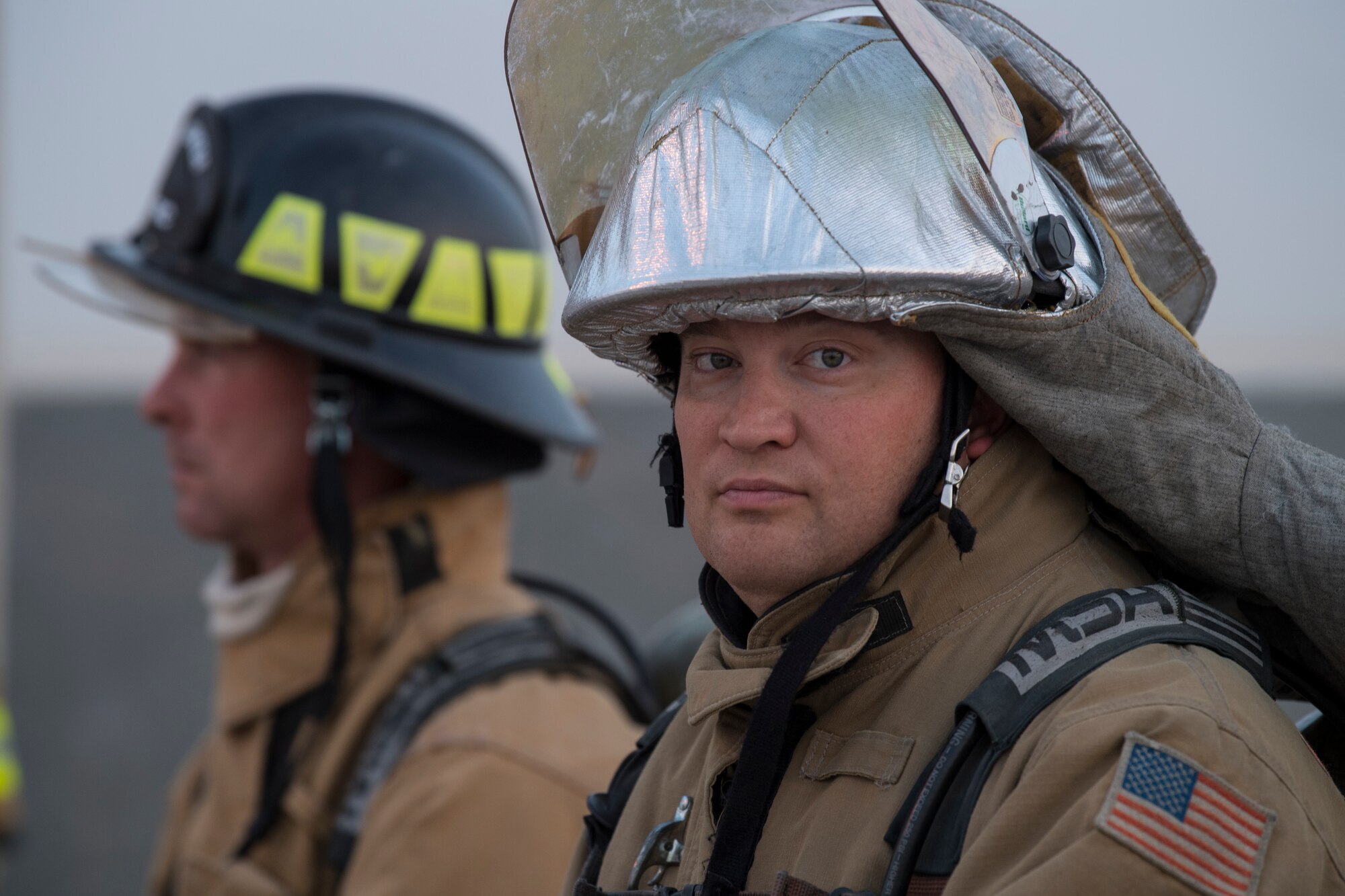 Firefighters from the 386th Expeditionary Civil Engineer Squadron, watch a hazardous materials examination to ensure the safety of those involved at an undisclosed location in Southwest Asia, May 30, 2018. The firefighters were there in case anything went wrong. (U.S. Air Force photo by Staff Sgt. Joshua King)