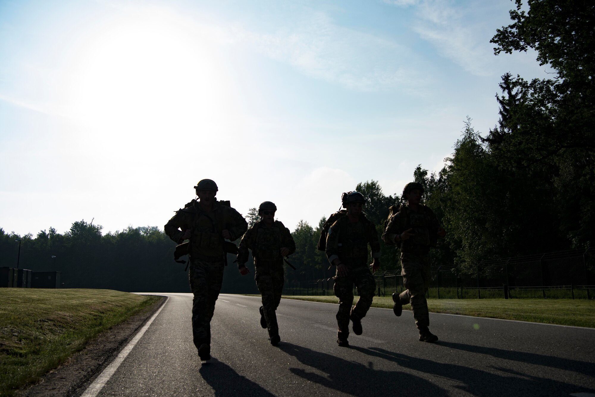 Members of the 435th Contingency Response Group lead the pack in the four mile ruck march, which kicked off the 435th CRG Olympics, on Ramstein Air Base, Germany, May 18, 2018. The Airmen shown here finished the four mile ruck march, carrying over 35 pounds in their backpacks, in under 43 minutes.
