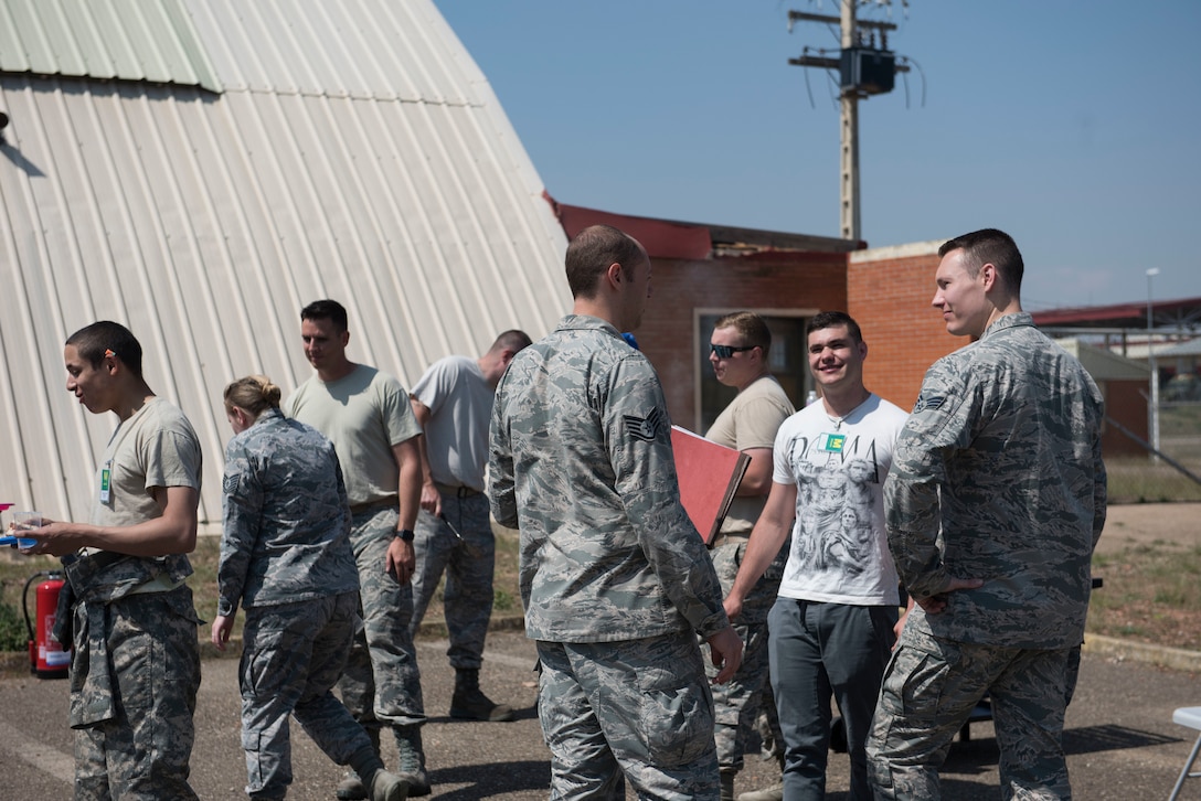 U.S. Air Force Airmen deployed with the 351st Expeditionary Air Refueling Squadron congregate during a resiliency training sponsored barbeque at Zaragoza, Spain, May 24, 2018.The 100th Aircraft Maintenance Squadron provided resiliency training for the Airmen in the deployed environment which was the first of its kind and will hopefully expand to other deployed locations. (U.S. Air Force photo by Airman 1st Class Alexandria Lee)