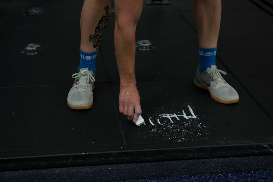 U.S. Air Force Senior Airman Kristofer Kabalan, 20th Equipment Maintenance Squadron aerospace ground equipment journeyman, marks a line with chalk at Shaw Air Force Base, S.C., May 24, 2018.