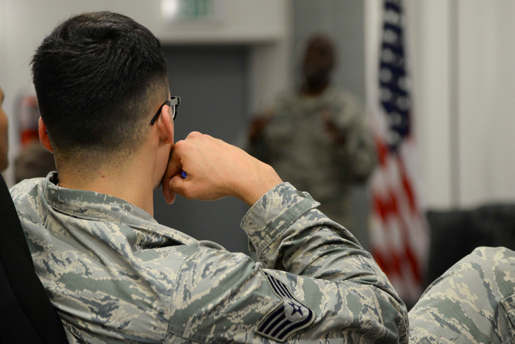 A noncommissioned officer listens to a panel of senior noncommissioned officers at the second annual Atlantic Stripe Conference at the U.S. Air Forces in Europe and Air Forces Africa conference room on Ramstein Air Base, Germany, May 17, 2018. During the professional development conference NCOs listened to leaders, mentors, and guest speakers advise them on different fundamentals and principles of leadership. (U.S. Air Force photo by Airman 1st Class D. Blake Browning)