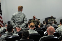 A noncommissioned officer asks a question during a panel of senior noncommissioned officers at the second annual Atlantic Stripe Conference that was held at the U.S. Air Forces in Europe and Air Forces Africa conference room on Ramstein Air Base, Germany, May 17, 2018. The conference aimed at deliberately developing junior NCOs who show potential to lead at higher levels. (U.S. Air Force photo by Airman 1st Class D. Blake Browning)