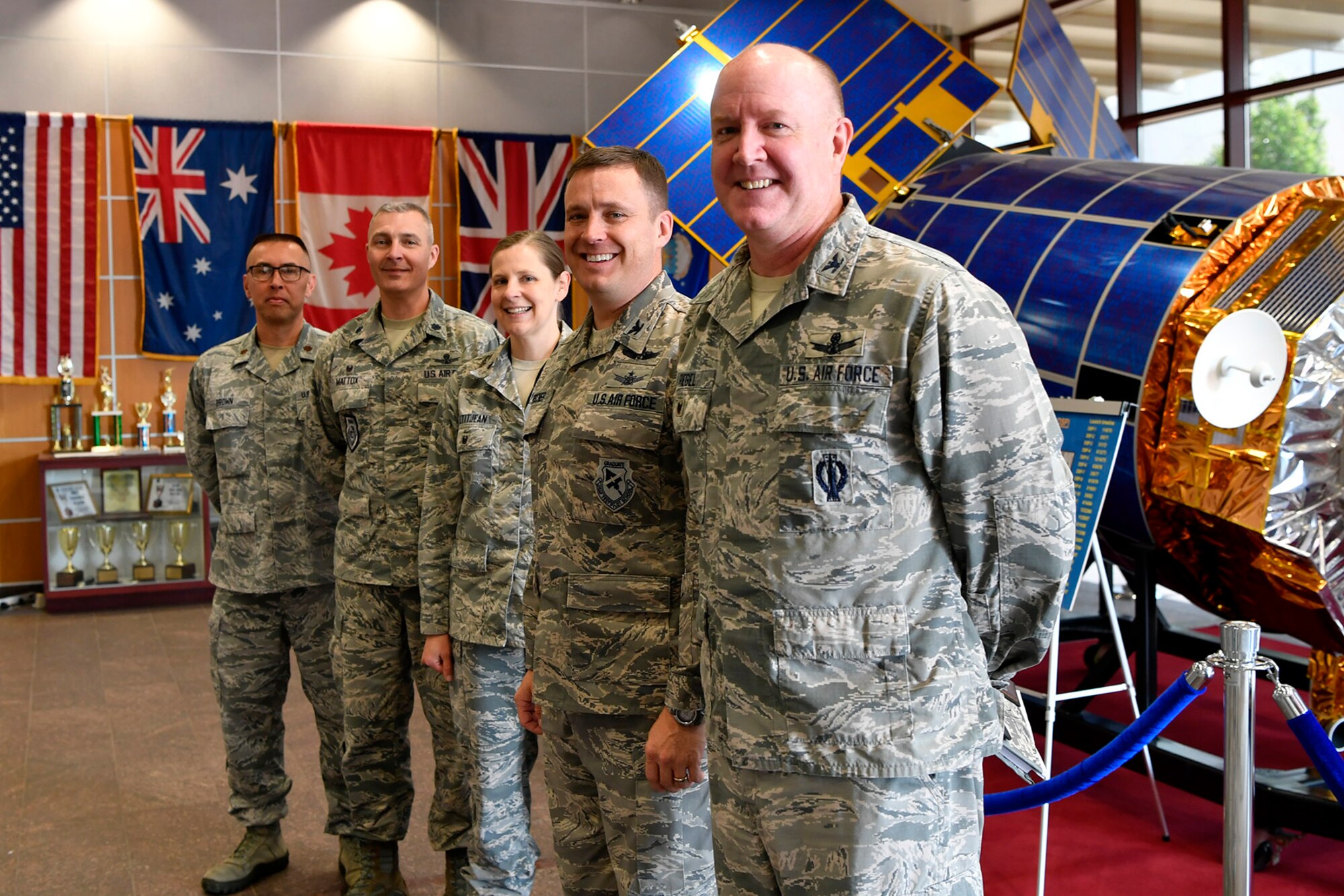 Col. Jack “2 Fish” Fischer, NASA astronaut, stands with base leadership, May 22, 2018, at Buckley Air Force Base, Colorado. Fischer’s tour of the installation included a luncheon at the Panther Den where he visited with Airmen of the 460th Space Wing and answered their questions about the Air Force and career opportunities. (U.S. Air Force photo by Senior Airman Madison J. Ratley)