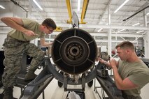 Airman 1st Class Austin Maurer, right, and Airman 1st Class Blain Gehrett, 23d Maintenance Squadron (MXS) aerospace propulsion technicians, repair a Turbo-Fan(TF)-34 engine, May 16, 2018, at Moody Air Force Base, Ga. The 23d MXS propulsion flight’s mission is to ensure that the A-10C Thunderbolt II TF-34 engine is in satisfactory condition before it’s even installed on the aircraft. This flight is responsible for the overall upkeep and maintenance of all TF-34 engines for the Air Force’s largest operational A-10 fighter group. (U.S. Air Force photo by Airman 1st Class Eugene Oliver)