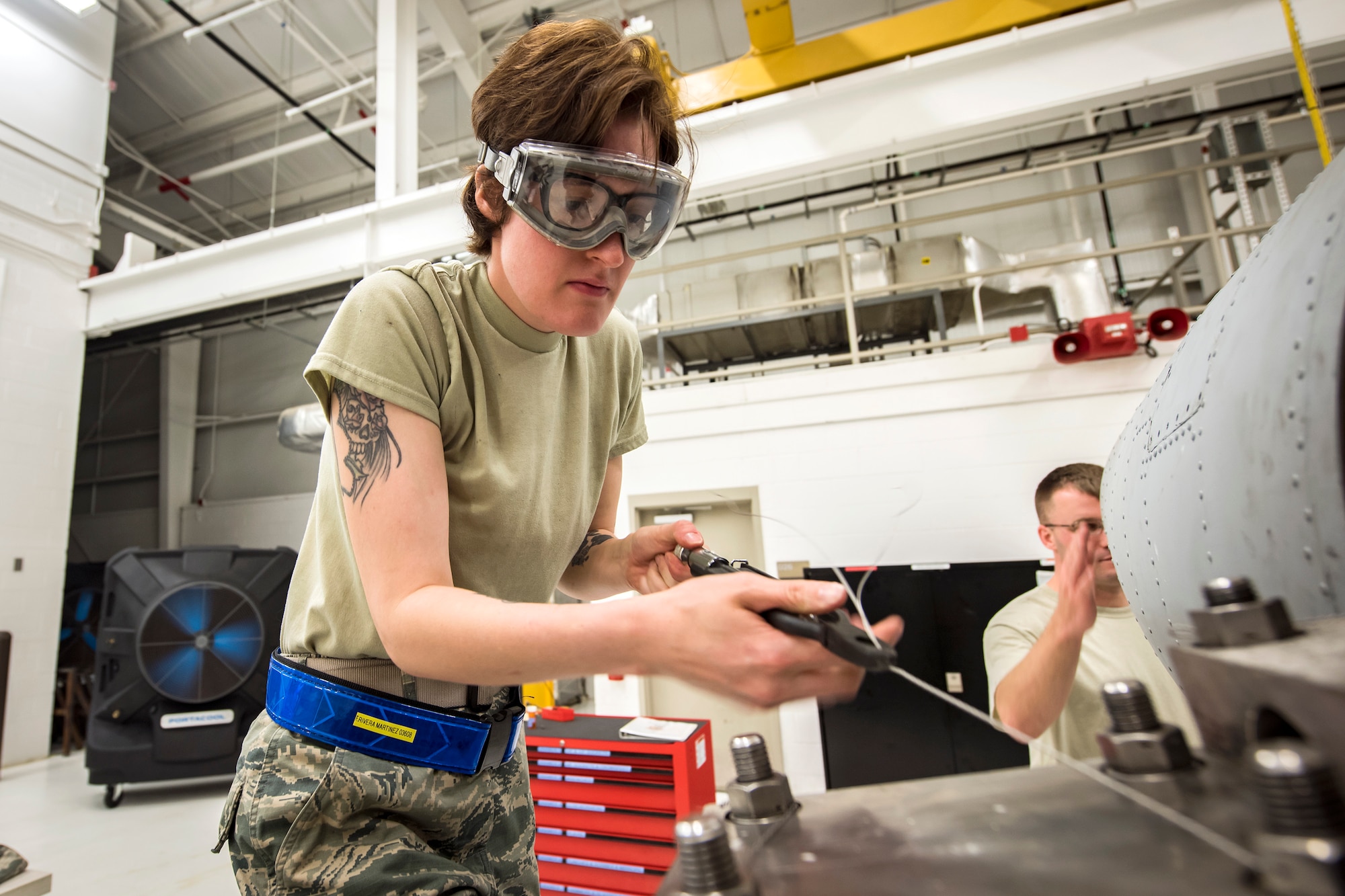 Airman 1st Class Emilie Rivera-Martinez, 23d Maintenance Squadron (MXS), aerospace propulsion apprentice, twists a wire on a Turbo-Fan (TF)-34 engine, May 16, 2018, at Moody Air Force Base, Ga. The 23d MXS propulsion flight’s mission is to ensure that the A-10C Thunderbolt II TF-34 engine is in satisfactory condition before it’s even installed on the aircraft. This flight is responsible for the overall upkeep and maintenance of all TF-34 engines for the Air Force’s largest operational A-10 fighter group. (U.S. Air Force photo by Airman 1st Class Eugene Oliver)