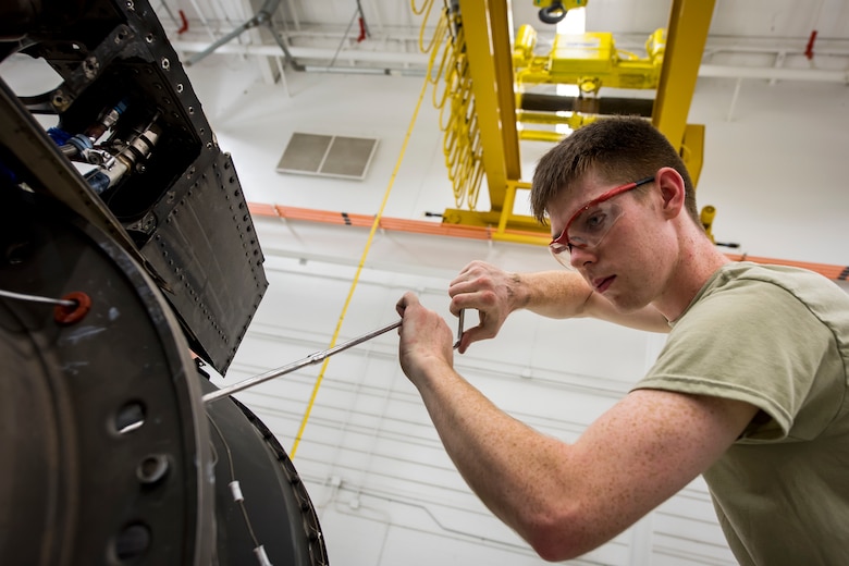 Airman 1st Class Blain Gehrett, 23d Maintenance Squadron (MXS) aerospace propulsion technician, repairs a Turbo-Fan (TF)-34 engine, May 16, 2018, at Moody Air Force Base, Ga. The 23d MXS propulsion flight’s mission is to ensure that the A-10C Thunderbolt II TF-34 engine is in satisfactory condition before it’s even installed on the aircraft. This flight is responsible for the overall upkeep and maintenance of all TF-34 engines for the Air Force’s largest operational A-10 fighter group. (U.S. Air Force photo by Airman 1st Class Eugene Oliver)