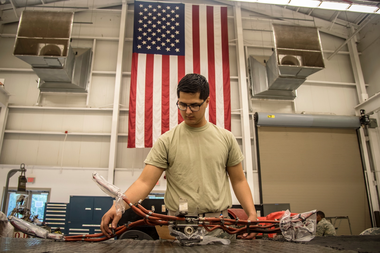 Airman 1st Class Jordan Vasquez, 23d Maintenance Squadron (MXS) aerospace propulsion technician, inspects the fuel lines of a Turbo-Fan (TF)-34 engine, May 16, 2018, at Moody Air Force Base, Ga. The 23d MXS propulsion flight’s mission is to ensure that the A-10C Thunderbolt II TF-34 engine is in satisfactory condition before it’s even installed on the aircraft. This flight is responsible for the overall upkeep and maintenance of all TF-34 engines for the Air Force’s largest operational A-10 fighter group. (U.S. Air Force Base photo by Airman 1st Class Eugene Oliver)