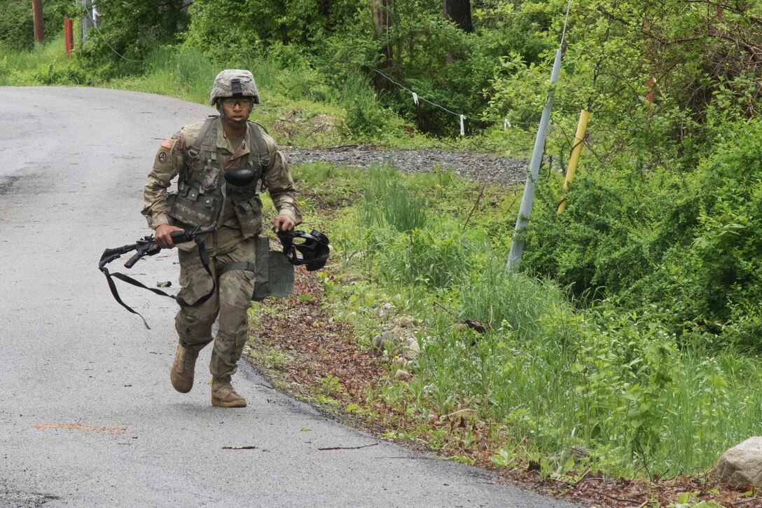 A soldier moves tactically to his next task during the stress shoot exercise.