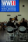 Gunnery Sgt. Justin Hauser, band master with Marine Forces Reserve Band, conducts the band during a Memorial Day Remembrance ceremony at the World War II Museum in New Orleans, May 26, 2018. The ceremony was an opportunity for the band to perform in honor of the men and women who have given the ultimate sacrifice for their nation.  (U.S. Marine Corps photo by Lance Cpl. Melany Vasquez/ Released)