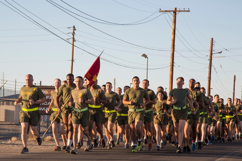 U.S. Marines stationed with Headquarters and Headquarters Squadron (H&HS), Marine Corps Air Station (MCAS) Yuma, Ariz., conduct a motivational run on MCAS Yuma, Ariz., May 25, 2018. H&HS conducted the motivational run to kick off the Memorial Day 96 hour liberty period, and to say farewell to Lt. Col. James S. Tanis. Lt. Col. Tanis served as the commanding officer of H&HS  for the past two years. (U.S. Marine Corps photo by Sgt. Allison Lotz)
