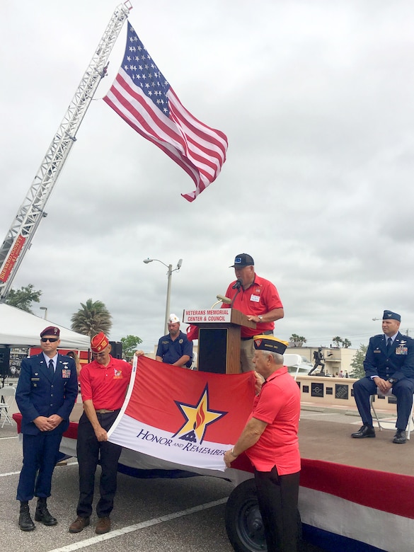 A year-and-a-half into commanding the 920th Rescue Wing and Col. Kurt A. Matthews is getting ready to attend his fourth burial. The tragedy of the past year brought Memorial Day 2018 into perspective for 2,000 Reserve Citizen Airmen that serve with the 920th RQW. Matthews honored the lives of four wing members who were lost within the past year, two who were killed in combat March 15, 2018, MSgt. Bill Posch and SSgt. Carl Enis. During the event at the Brevard Veterans Center, Matthews presented the Honor and Sacrifice Flag to Lt. Col. Tim Hanks, 308th Rescue Squadron commander, to honor the ultimate sacrifice of 308th members Posch and Enis. (U.S. Air Force photo by Mr. Darrell Hankins)