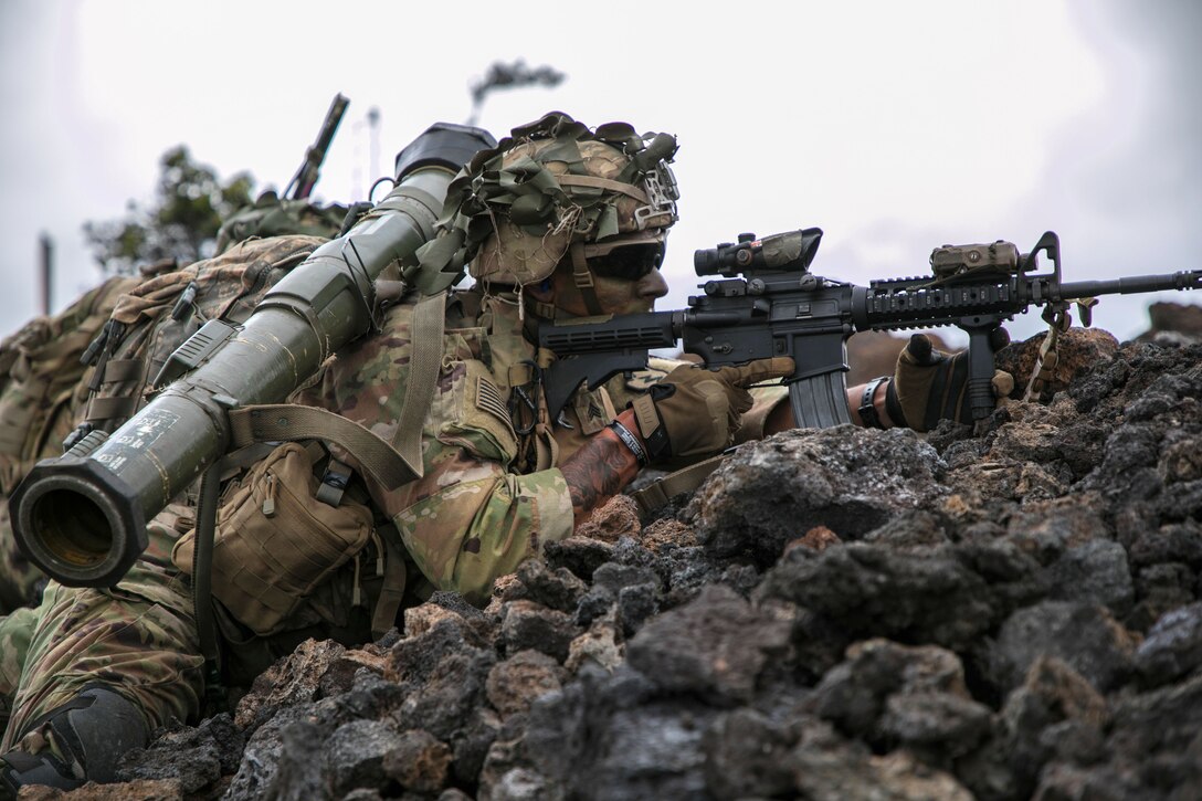 A soldier provides cover fire during a combined arms live-fire exercise.