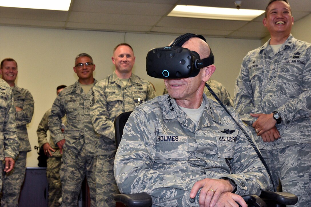 U.S. Air Force Gen. Mike Holmes, Commander of Air Combat Command, wears a virtual reality headset to experience a training demonstration put on by the 17th Training Group at the Brandenburg Hall on Goodfellow Air Force Base, Texas, May 30, 2018. This training will allow students to study outside of the class on computers, laptops or tablets. (U.S. Air Force photo by Senior Airman Randall Moose/Released)