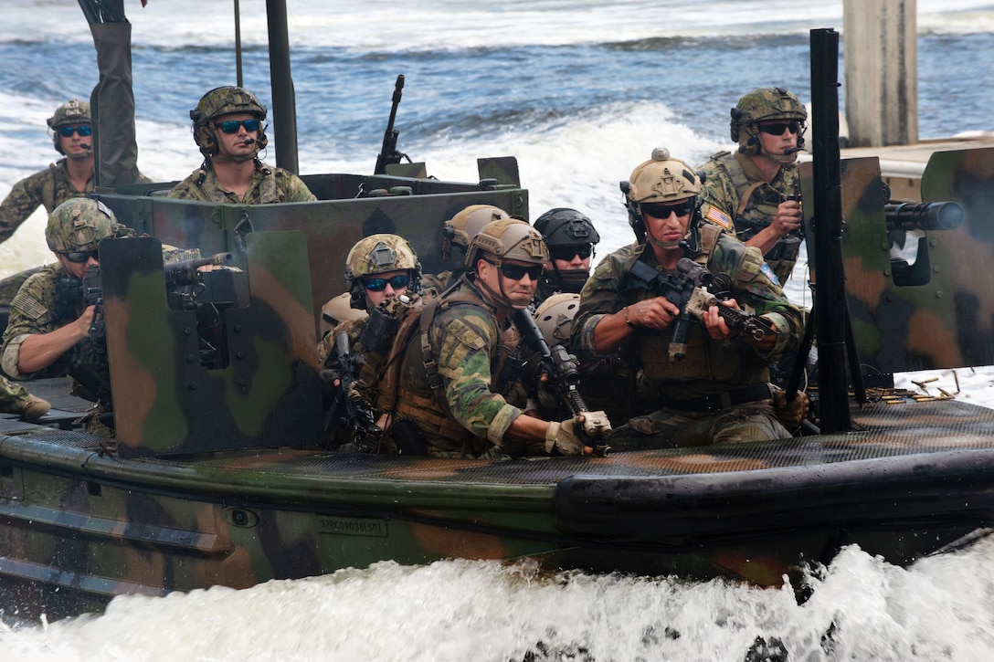 U.S. and multinational special operations forces conduct an amphibious assault.
