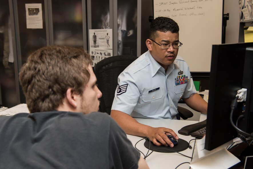 Staff Sgt. Sherard Bilbo, 345th Recruiting Squadron recruiter, speaks with a recruit May 14, 2018, at the Air Force Recruiting Office, Faiview Heights, Illinois. A recruiter's mission is to inspire, engage and recruit new Airmen. (U.S. Air Force photo by Senior Airman Melissa Estevez)