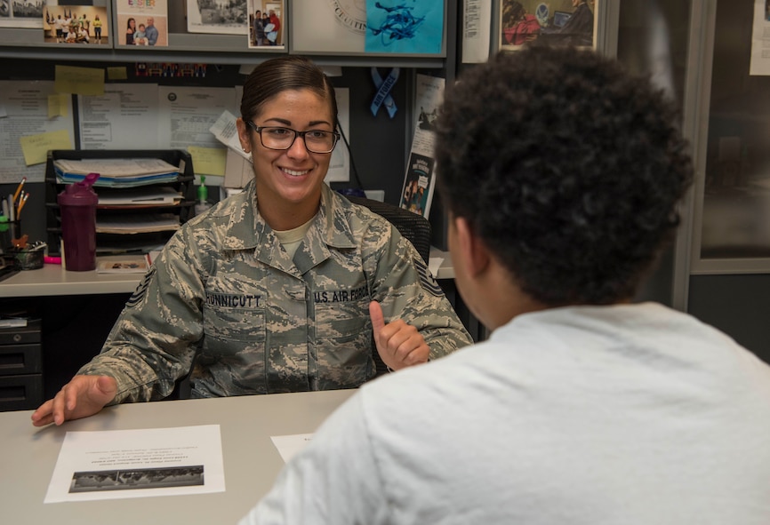 Tech. Sgt. Merissa Hunnicutt, 345th Recruiting Squadron recruiter, speaks with a recruit about the Military Entrance Processing Station, May 14, 2018, at the Air Force Recruiting Office, Faiview Heights, Illinois. The 345th RCS is on track to enlist approximately 1,100 new Airmen this year. (U.S. Air Force photo by Senior Airman Melissa Estevez)