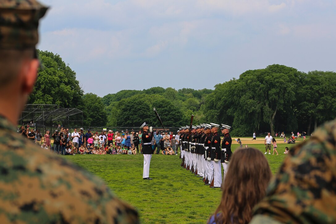 Marines with the U.S. Marine Corps Silent Drill Platoon execute their “bursting bomb” sequence during their performance as a part of a Battle Color Ceremony for New York Fleet Week at Prospect Park, Brooklyn, NY, May 26, 2018. Fleet Week New York is an opportunity for the American public to meet their Marine Corps, Navy and Coast Guard teams and experience America’s sea services. (Official Marine Corps photo by Cpl. Damon Mclean/Released)