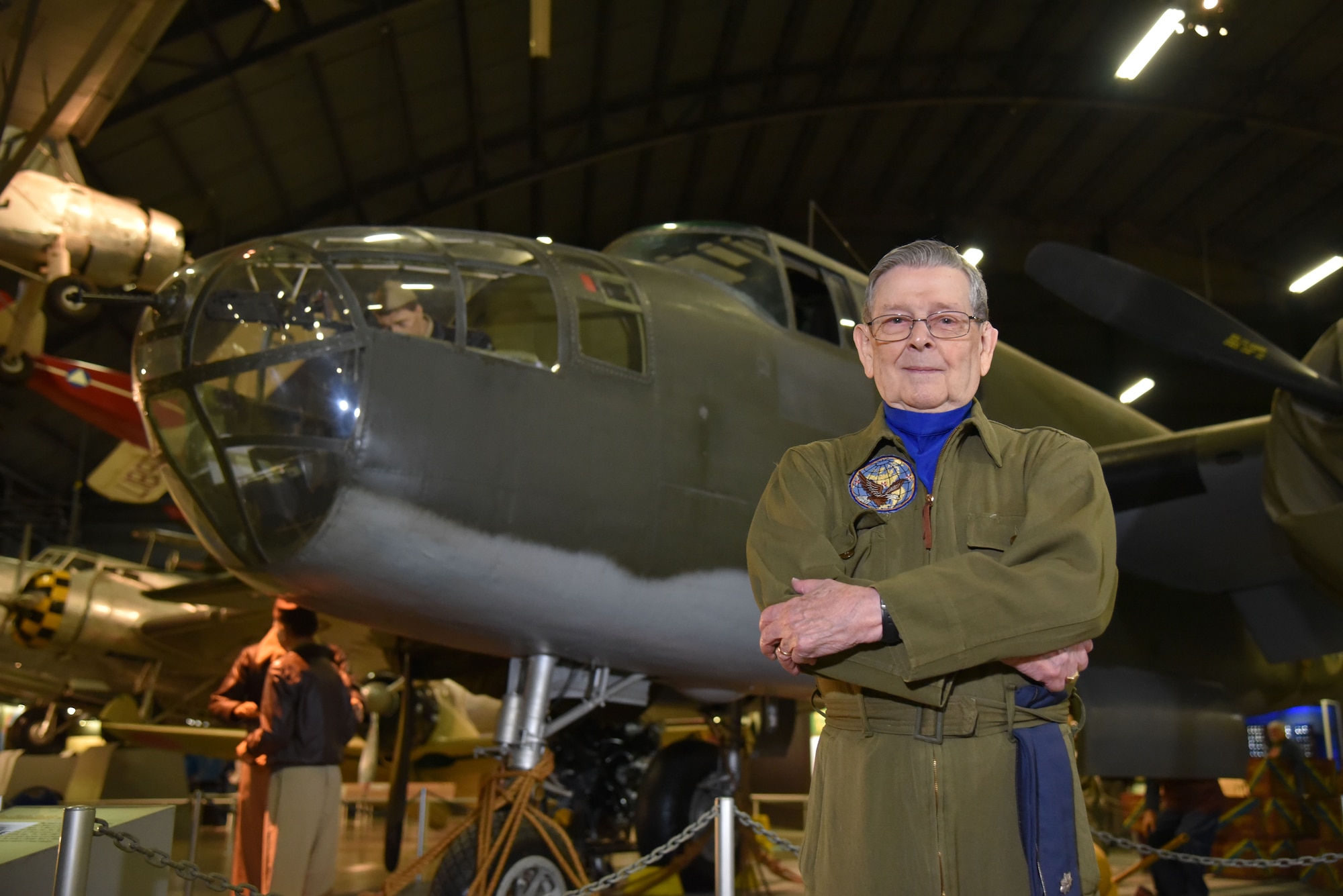 Former Air Force pilot Jack Hampshire poses for a photo in front of a North American B-25B Mitchell in the WWII Gallery at the National Museum of the U.S. Air Force.(U.S. Air Force photo by Ken LaRock)