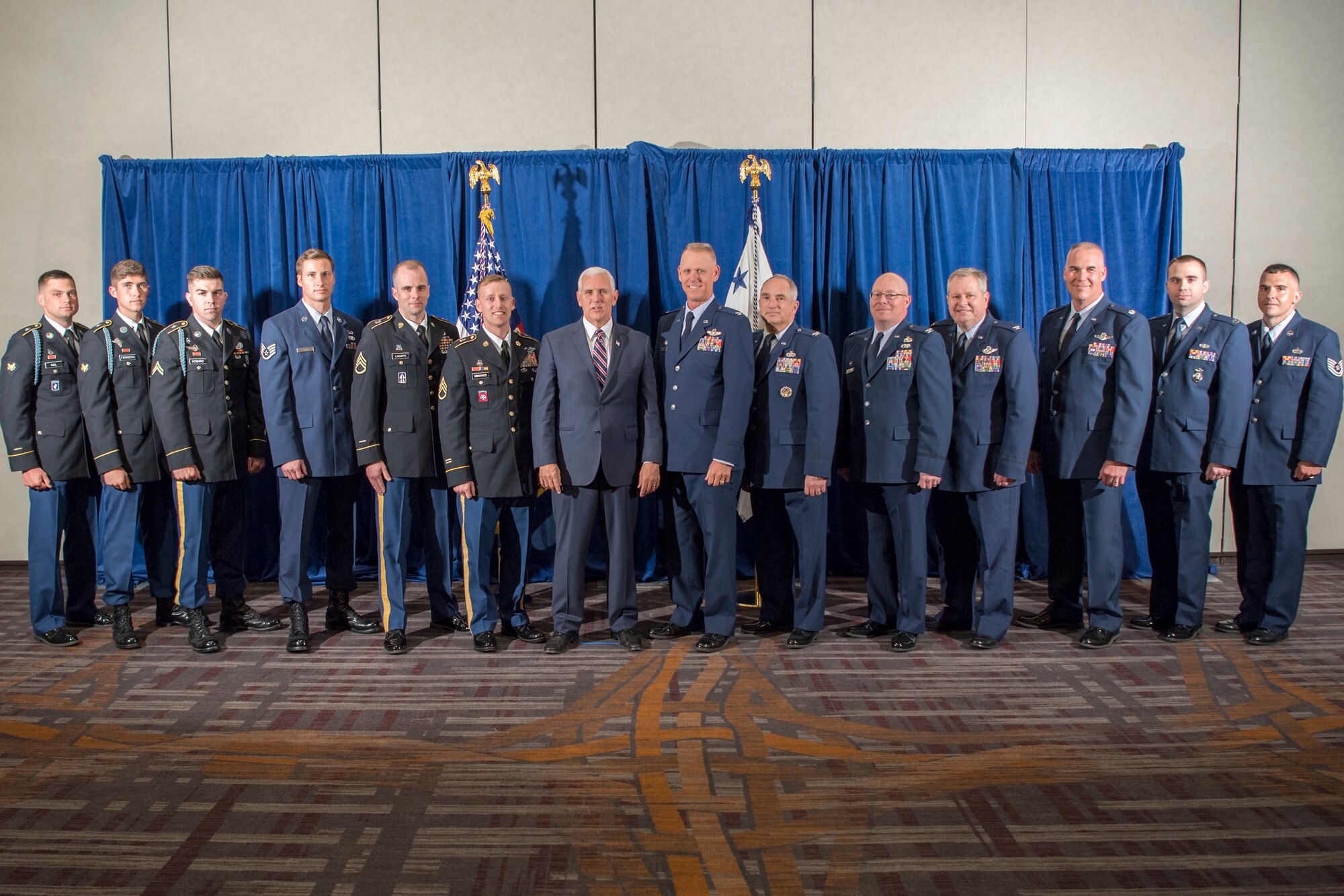 Airmen from the 434th Air Refueling Wing and Soldiers from the Indiana Army National Guard pose for a photo with Vice President Mike Pence during a meet-and-greet in Indianapolis May 18, 2018. The Airmen and Soldiers were hand selected to meet Pence as he returned to his Hoosier hometown discussing tax reform and the impact it has had on American citizens. (U.S. Air Force photo/Tech. Sgt. Benjamin Mota)