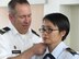 Lt. Col. An Duong, the 28th Medical Group chief of aerospace medicine, is pinned on by her husband, Army Col. Steven Roemhildt, Nov. 16, 2012. Duong was born in Vietnam, but moved to the United States and became a medical professional before commissioning into the Air Force. (Courtesy photo)