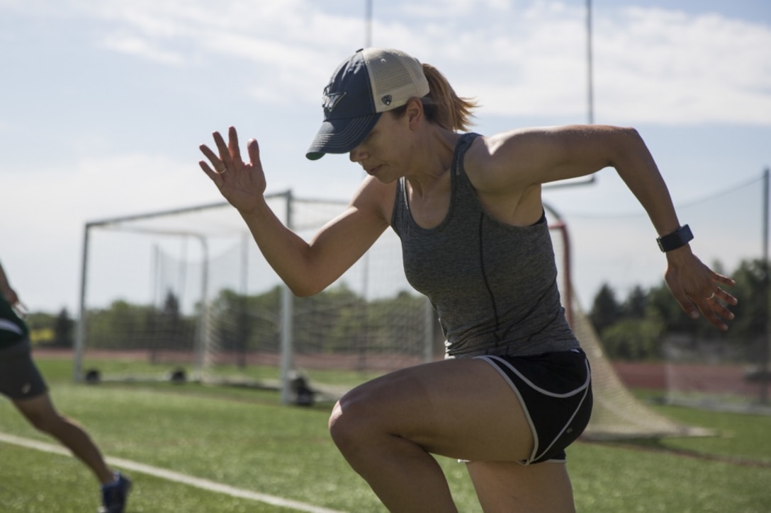 Marine Corps 1st Lt. Kerstin Caesar warms up during 2018 Department of Defense Warrior Games track practice at Cheyenne Mountain High School in Colorado Springs, Colo.
