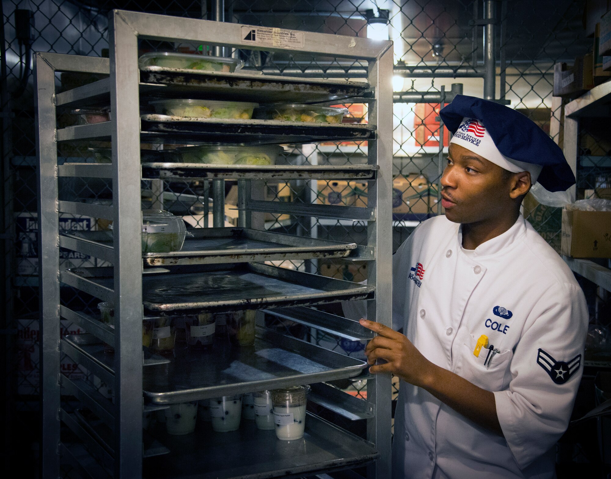 U.S. Air Force Airman 1st Class Kobe Cole, a food service journeyman assigned to the 6th Force Support Squadron, transports cold food items at MacDill Air Force Base, Fla., May 30, 2018.