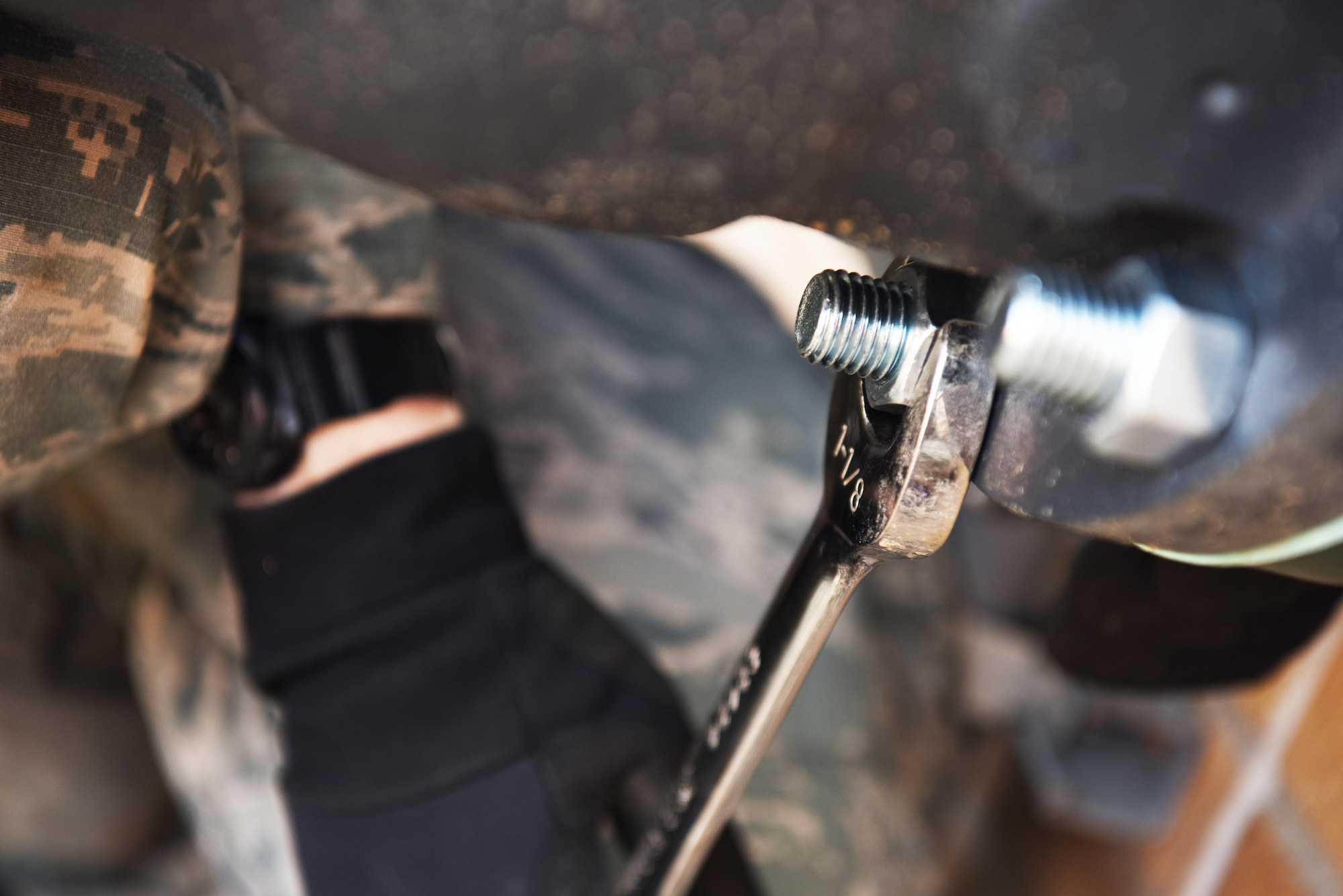 Airman 1st Class Christopher Pearce, a 28th Civil Engineer Squadron heating, ventilation and air conditioning apprentice, tightens a bolt attached to a valve with a wrench at Ellsworth Air Force Base, S.D., May 3, 2018. The 28th CES HVAC shop is responsible for installing and maintaining all of Ellsworth’s heating, cooling, ventilation and refrigeration equipment. (U.S. Air Force photo by Airman 1st Class Thomas Karol)