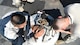Senior Airman Julian Hernandez, a 28th Civil Engineer Squadron heating, ventilation and air conditioning journeyman, and Airman 1st Class Michael Schall, a 28th CES HVAC apprentice, attach a motor that powers a fan at Ellsworth Air Force Base, S.D., May 3, 2018.  The 28th CES HVAC shop is responsible for installing and maintaining all of Ellsworth’s heating, cooling, ventilation and refrigeration equipment. (U.S. Air Force photo by Airman 1st Class Thomas Karol)
